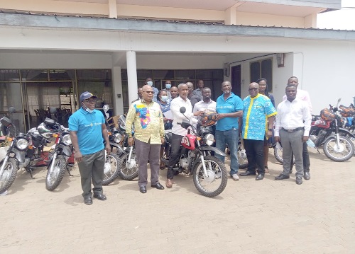 Mr Ako Odotei (3rd right), Chairman of Host Committee of Rotary International-USAID Water and Sanitation Project, handing over one of the motorbikes to Mr Seth Sabutey (seated on a motorbike), Presiding Member of the Shai Osudoku District Assembly, while others look on. Picture: BENJAMIN XORNAM GLOVER Mr Ako Odotei (3rd right), Chairman of Host Committee of Rotary International-USAID Water and Sanitation Project, handing over one of the motorbikes to Mr Seth Sabutey (seated on a motorbike), Presiding Member of the Shai Osudoku District Assembly, while others look on. Picture: BENJAMIN XORNAM GLOVER